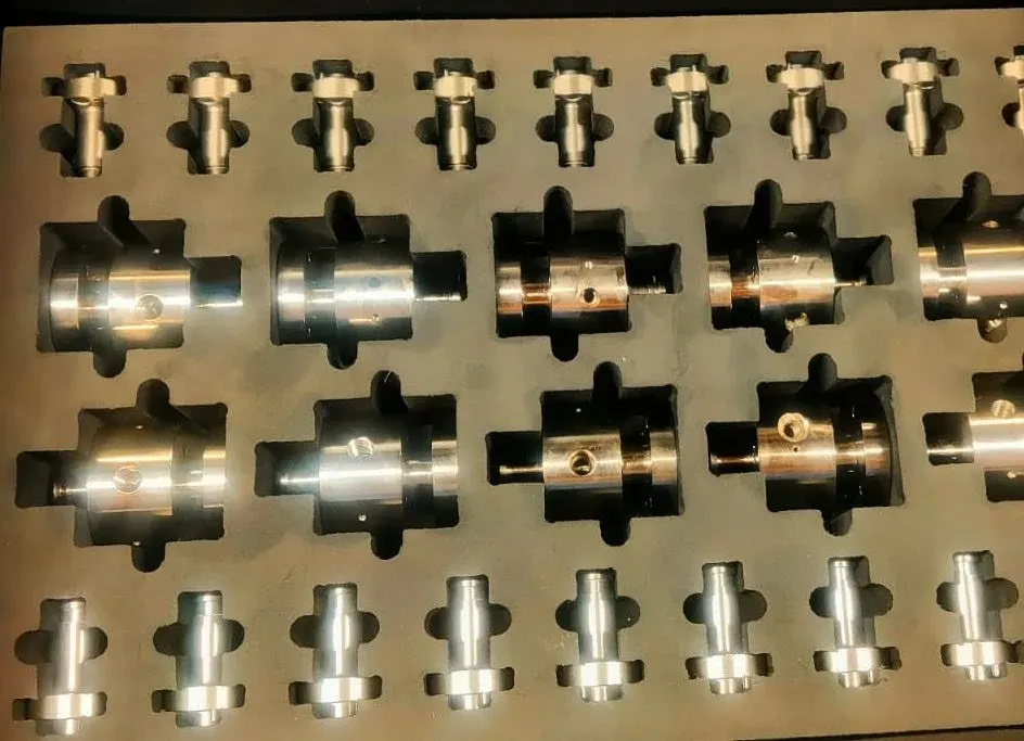 3D-printed bespoke packaging cradling precision-machined parts